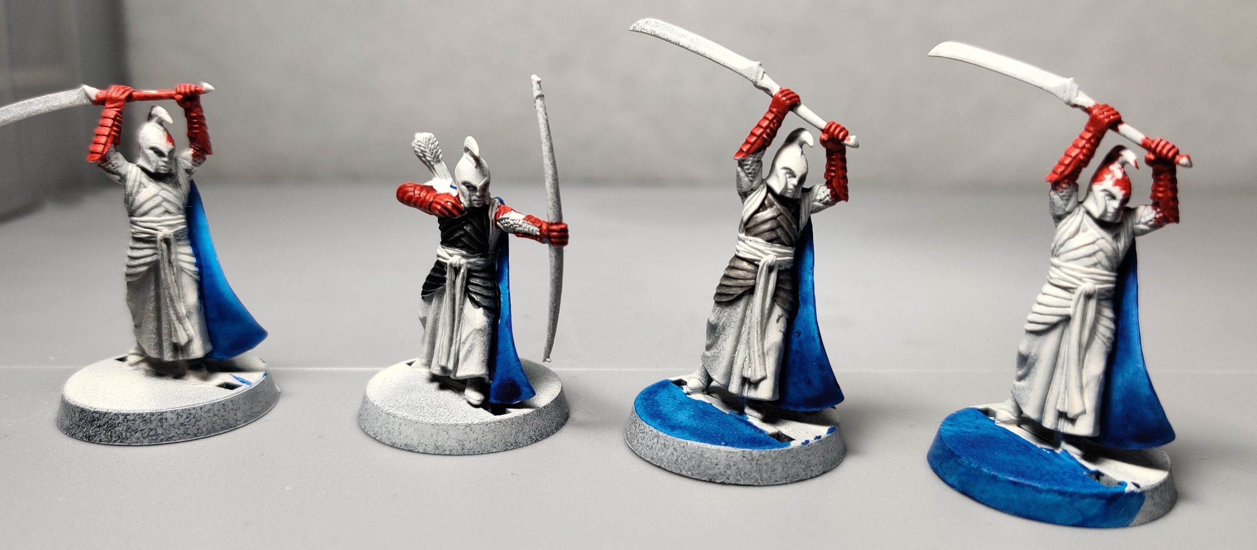 Red, white, and blue LOTR high elves from the front.